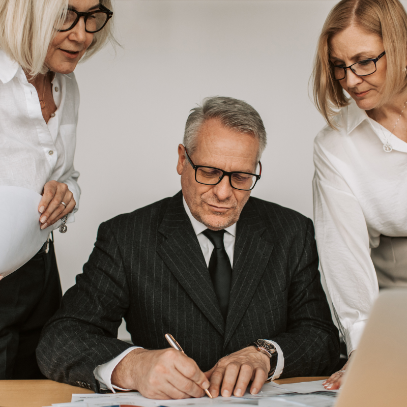 tax professional reviewing business filing notice with client