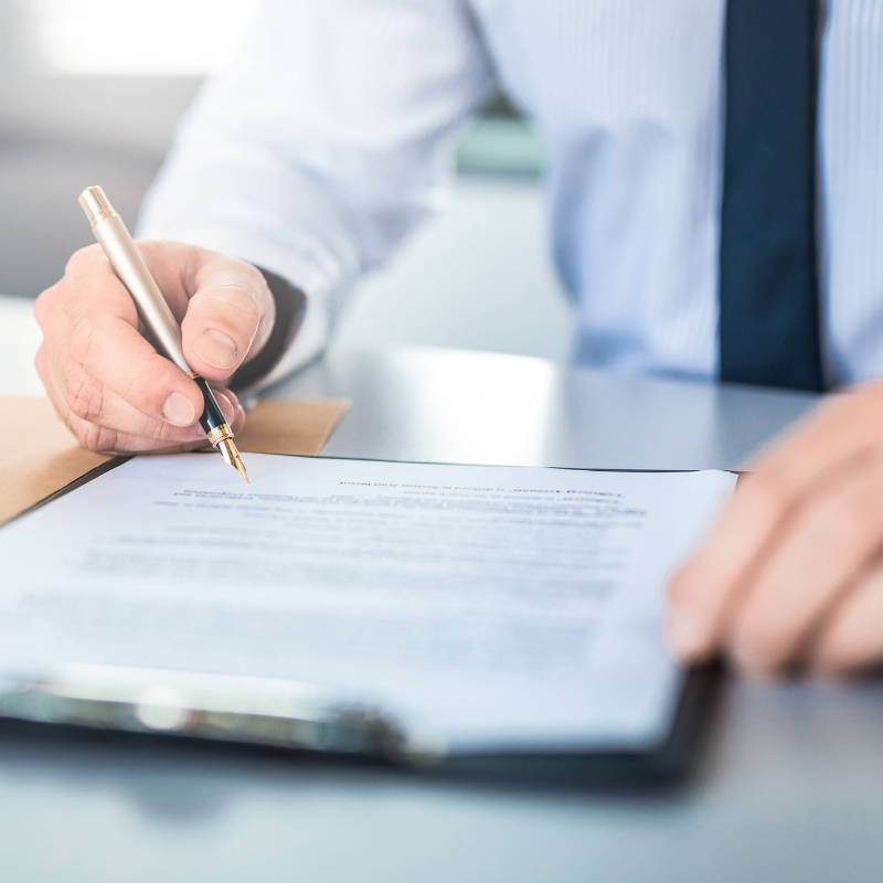 entrepreneur signing business formation documents